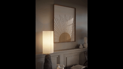 Aesthetic Mounted Wall Art Frame Mockup- a wall-mounted frame with a canvas of rays of sun with a background of a plain wall