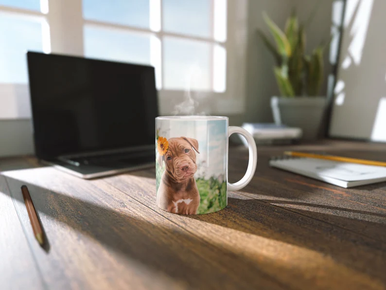 Office Design Mug Mockup with Steam Effects- a mug with graphic design of dog with a background of office setup